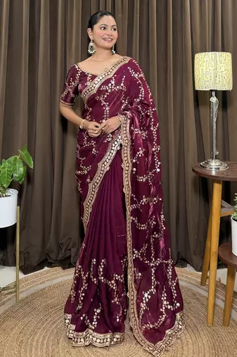 Wine tissue satin embroidered saree with unstitched blouse piece.