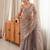 Grey tissue satin embroidered saree with unstitched blouse piece.