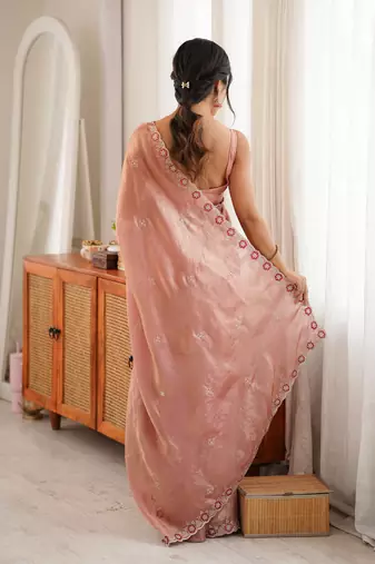 Peach tissue satin embroidered saree with unstitched blouse piece.