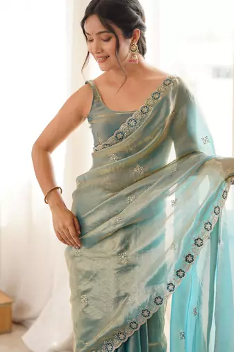 Sky blue tissue satin embroidered saree with unstitched blouse piece.