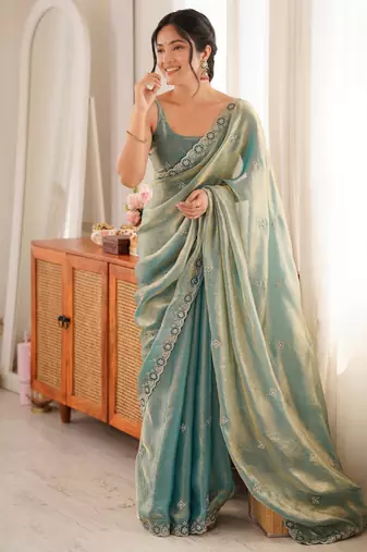 Sky blue tissue satin embroidered saree with unstitched blouse piece.