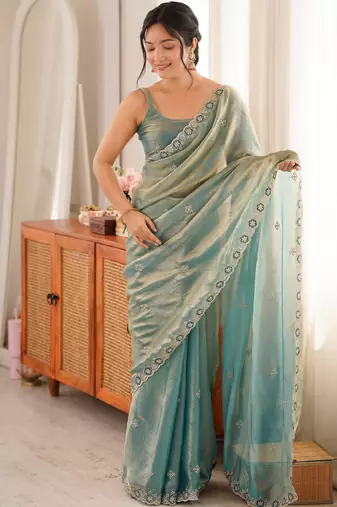 Sky blue tissue satin embroidered saree with unstitched blouse piece.