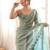 Sky blue tissue satin embroidered saree with unstitched blouse piece.