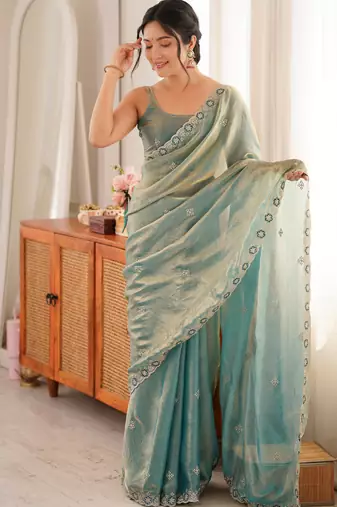 Sky blue tissue satin embroidered saree with unstitched blouse piece.