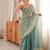 Sky blue tissue satin embroidered saree with unstitched blouse piece.