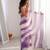 Lilac tissue satin striped saree with unstitched blouse piece.