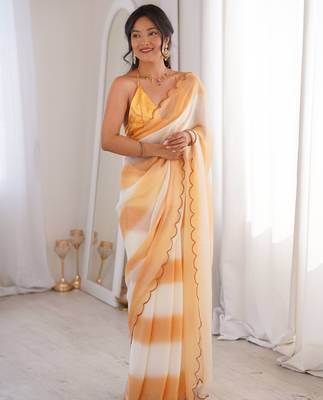 Mustard tissue satin striped saree with unstitched blouse piece. 1