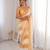 Mustard tissue satin striped saree with unstitched blouse piece.