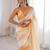 Mustard tissue satin striped saree with unstitched blouse piece.