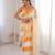 Mustard tissue satin striped saree with unstitched blouse piece.