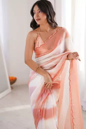 Peach tissue satin striped saree with unstitched blouse piece.