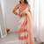 Peach tissue satin striped saree with unstitched blouse piece.