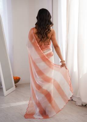 Peach tissue satin striped saree with unstitched blouse piece. 5
