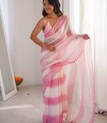 Pink tissue satin striped saree with unstitched blouse piece.