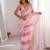 Pink tissue satin striped saree with unstitched blouse piece.