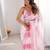 Pink tissue satin striped saree with unstitched blouse piece.