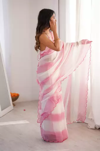 Pink tissue satin striped saree with unstitched blouse piece.