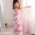 Pink tissue satin striped saree with unstitched blouse piece.