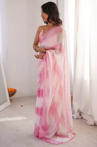 Pink tissue satin striped saree with unstitched blouse piece.