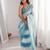 Sky blue tissue satin striped saree with unstitched blouse piece.