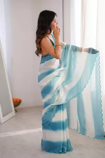 Sky blue tissue satin striped saree with unstitched blouse piece.