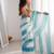 Sky blue tissue satin striped saree with unstitched blouse piece.