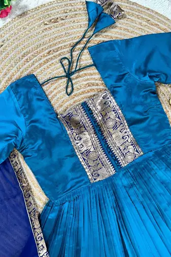 turquoise blue color rich zari border silk blend anarkali gown set