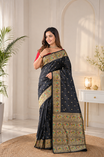 black color ilver zari chaap weaving buttis and a matching border completing silk blend saree