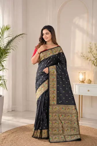 black color ilver zari chaap weaving buttis and a matching border completing silk blend saree