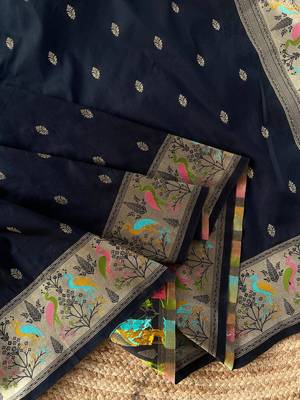 black color ilver zari chaap weaving buttis and a matching border completing silk blend saree 4