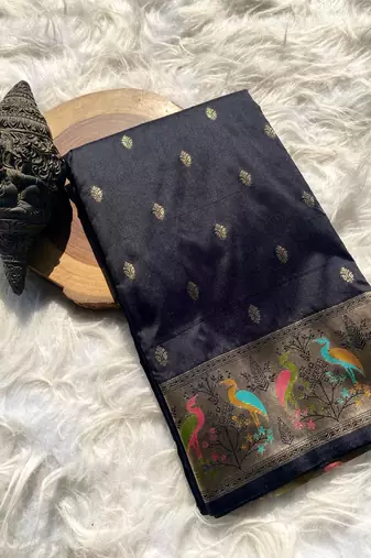 black color ilver zari chaap weaving buttis and a matching border completing silk blend saree