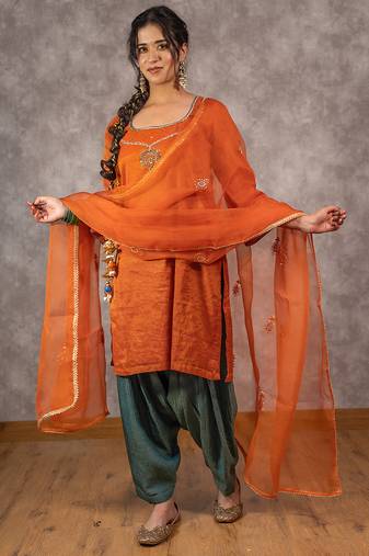 Orange tissue chnaderi kurta set with contrast salwar and matching dupatta, stitched