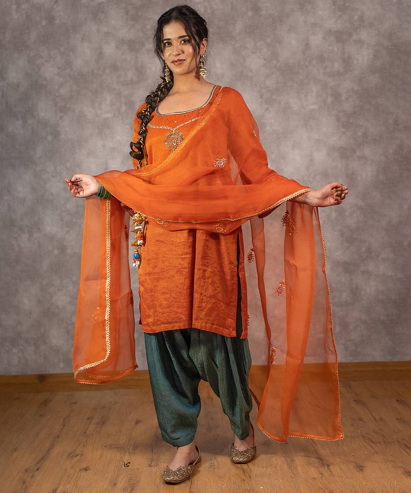 Orange tissue chnaderi kurta set with contrast salwar and matching dupatta, stitched