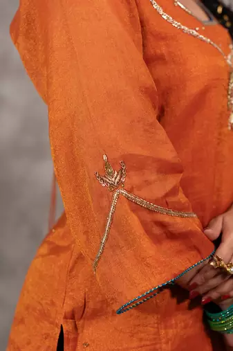 Orange tissue chnaderi kurta set with contrast salwar and matching dupatta, stitched