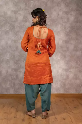 Orange tissue chnaderi kurta set with contrast salwar and matching dupatta, stitched