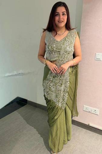 Olive green embroidered saree with intricate silver zari work