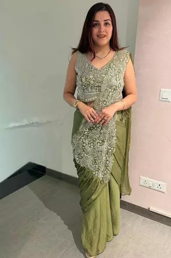 Olive green embroidered saree with intricate silver zari work