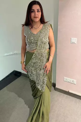 Olive green embroidered saree with intricate silver zari work