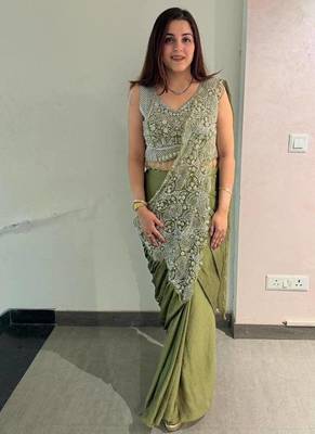 Olive green embroidered saree with intricate silver zari work 4
