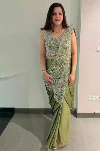 Olive green embroidered saree with intricate silver zari work