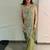 Olive green embroidered saree with intricate silver zari work
