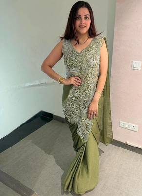 Olive green embroidered saree with intricate silver zari work 5
