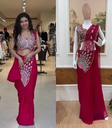 Royal fuchsia embroidered saree with peacock motif blouse