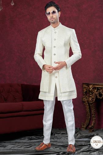 Cream embroidered indo-western sherwani set with thread, stone & fancy button work.
