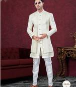 Cream embroidered indo-western sherwani set with thread, stone & fancy button work.