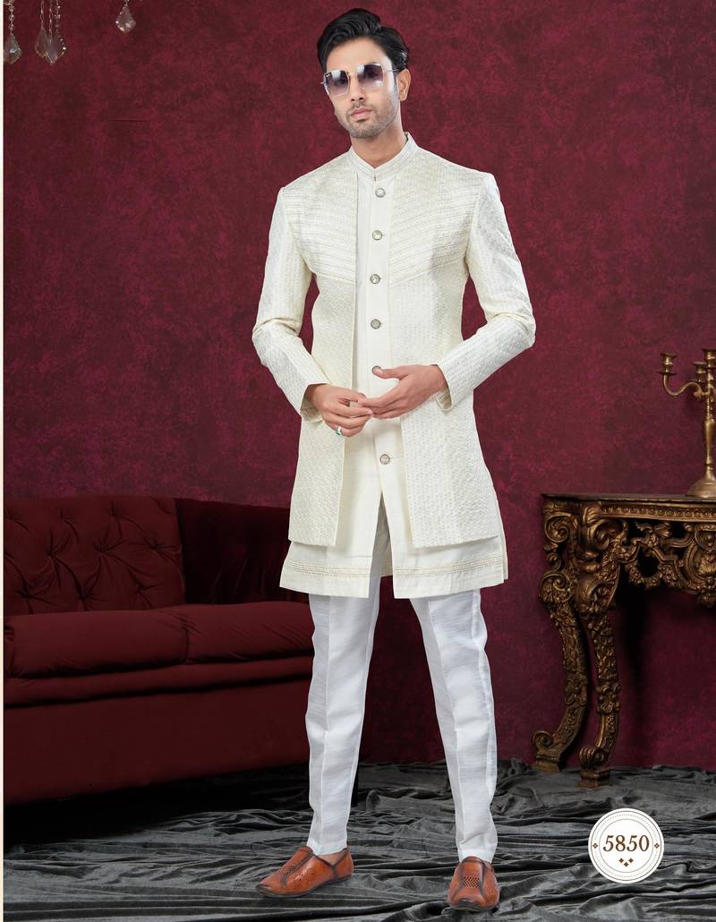 Cream embroidered indo-western sherwani set with thread, stone & fancy button work.