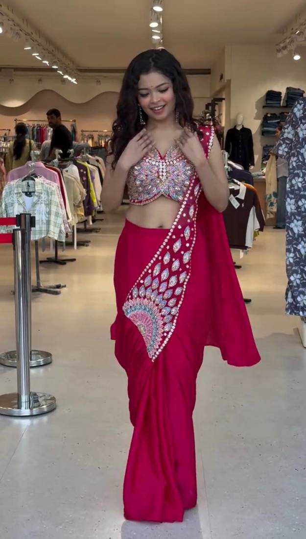 Royal fuchsia embroidered saree with peacock motif blouse