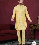 Yellow embroidered indo-western sherwani set with thread, stone & fancy button work.