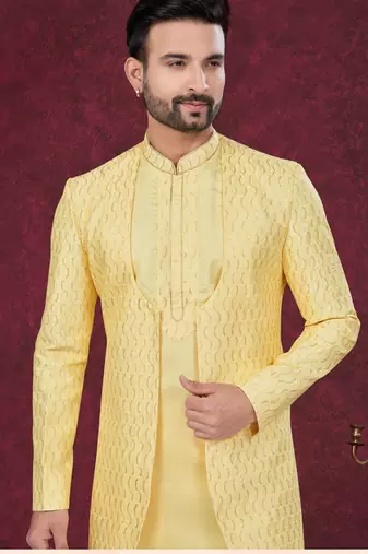 Yellow embroidered indo-western sherwani set with thread, stone & fancy button work.