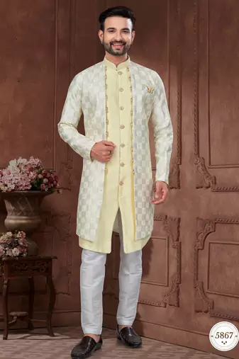 Light yellow & cream embroidered indo-western sherwani set with thread, stone & fancy button work.